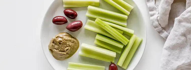 Celery With Almond Butter And Olives